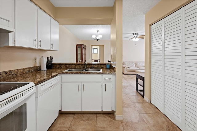 8436 60th St N Unit 304, Pinellas Park, FL 33781 - kitchen featuring white appliances, a sink, white cabinetry, ceiling fan, and light tile patterned floors