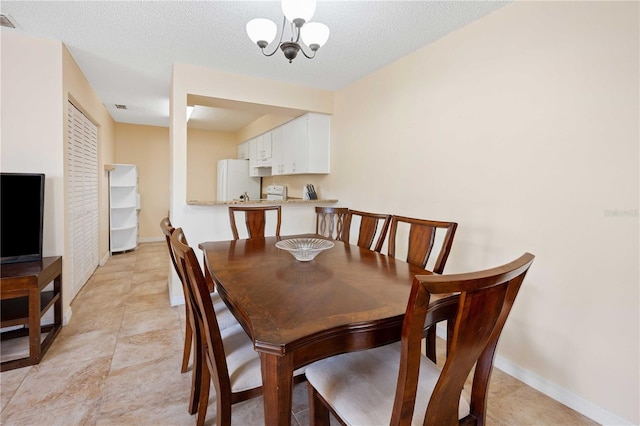 8436 60th St N Unit 304, Pinellas Park, FL 33781 - dining space featuring a chandelier and baseboards