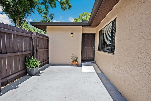 8436 60th St N Unit 304, Pinellas Park, FL 33781 - doorway to property with stucco siding