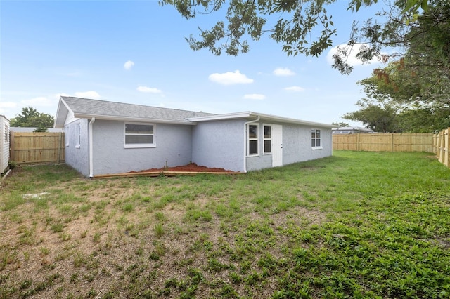 6804 Tierra Verde St, Port Richey, FL 34668 - rear view of house featuring stucco siding