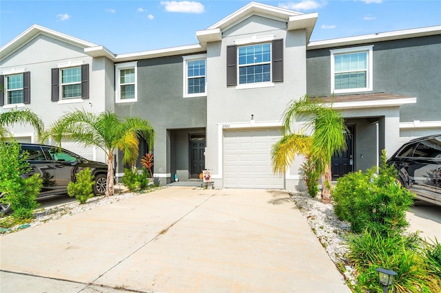 2925 Evergreen Elm Pass, Wesley Chapel, FL 33543 - multi unit property with a garage, stucco siding, and concrete driveway
