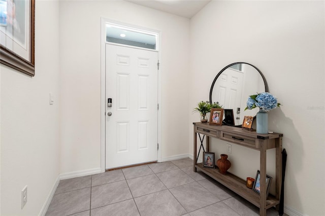 2925 Evergreen Elm Pass, Wesley Chapel, FL 33543 - entryway featuring light tile patterned flooring and baseboards