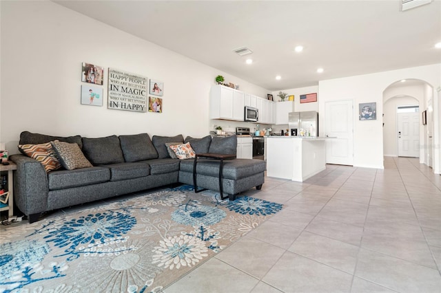 2925 Evergreen Elm Pass, Wesley Chapel, FL 33543 - living room with arched walkways, light tile patterned flooring, and recessed lighting