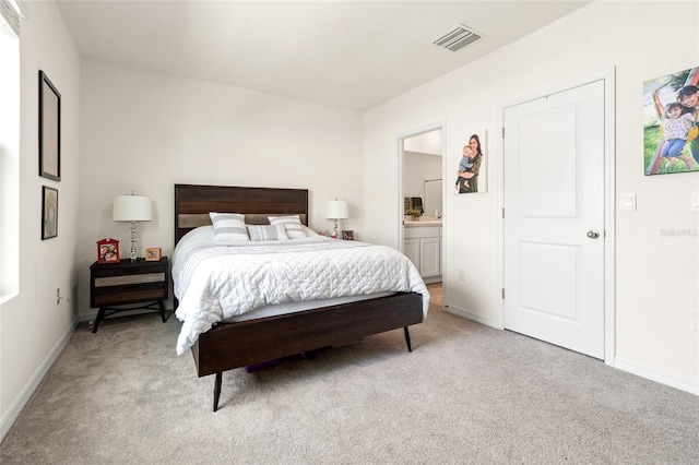 2925 Evergreen Elm Pass, Wesley Chapel, FL 33543 - bedroom featuring light carpet, baseboards, and ensuite bathroom