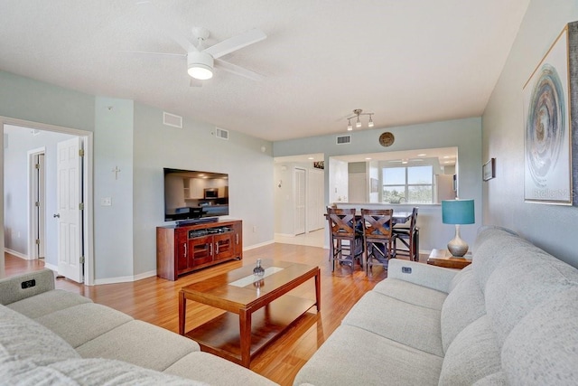 960 Starkey Rd Unit 2405, Largo, FL 33771 - living area with light wood-style flooring, a ceiling fan, and baseboards