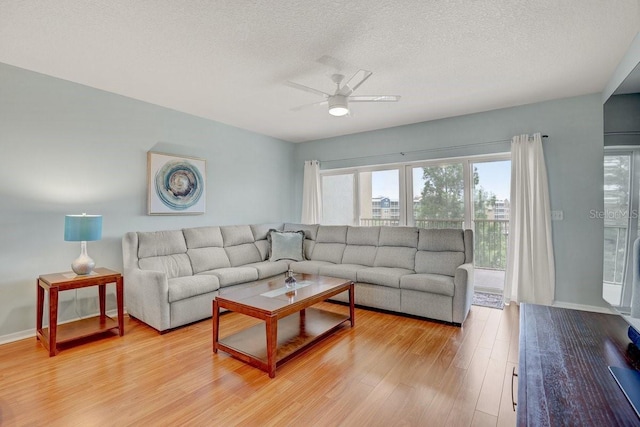 960 Starkey Rd Unit 2405, Largo, FL 33771 - living room with ceiling fan, light wood-style flooring, and a textured ceiling