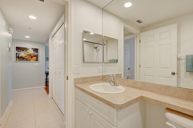 960 Starkey Rd Unit 2405, Largo, FL 33771 - bathroom with vanity, tile patterned flooring, recessed lighting, and baseboards