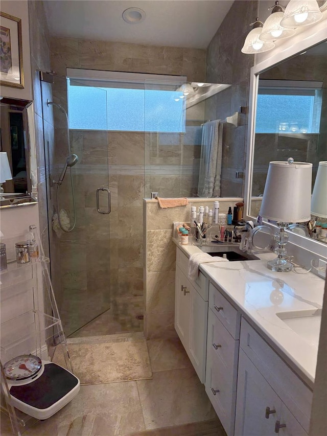 20938 Sunsweet Ct, Land O Lakes, FL 34637 - bathroom featuring a stall shower and double vanity