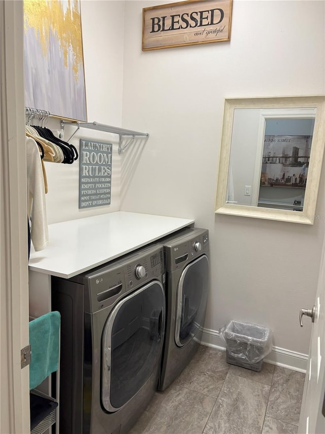 20938 Sunsweet Ct, Land O Lakes, FL 34637 - washroom featuring separate washer and dryer and baseboards
