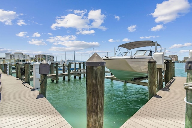 200 Skiff Pt Unit 202, Clearwater Beach, FL 33767 - dock area featuring boat lift and a water view