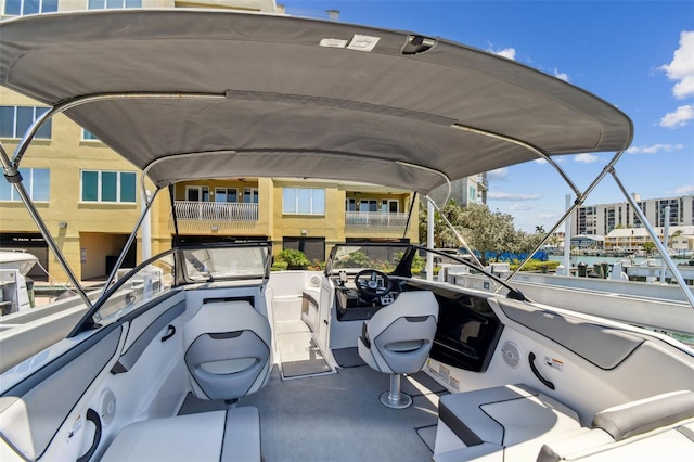 200 Skiff Pt Unit 202, Clearwater Beach, FL 33767 - view of car parking featuring a carport and a water view