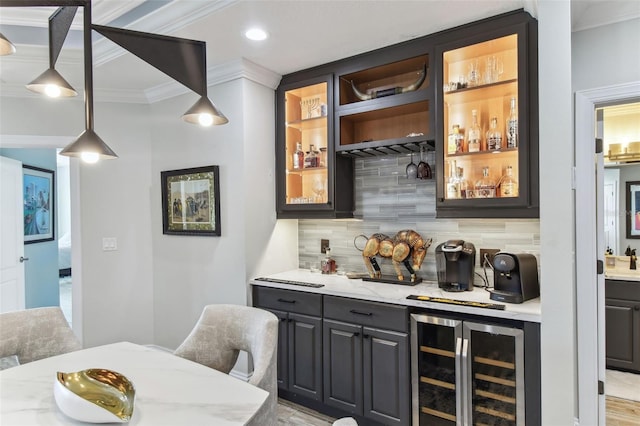 200 Skiff Pt Unit 202, Clearwater Beach, FL 33767 - indoor wet bar with wine cooler, ornamental molding, decorative backsplash, decorative light fixtures, and recessed lighting