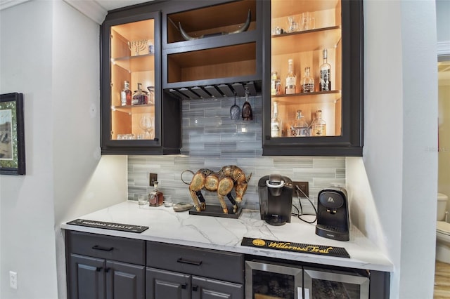 200 Skiff Pt Unit 202, Clearwater Beach, FL 33767 - indoor dry bar featuring decorative backsplash and wine cooler