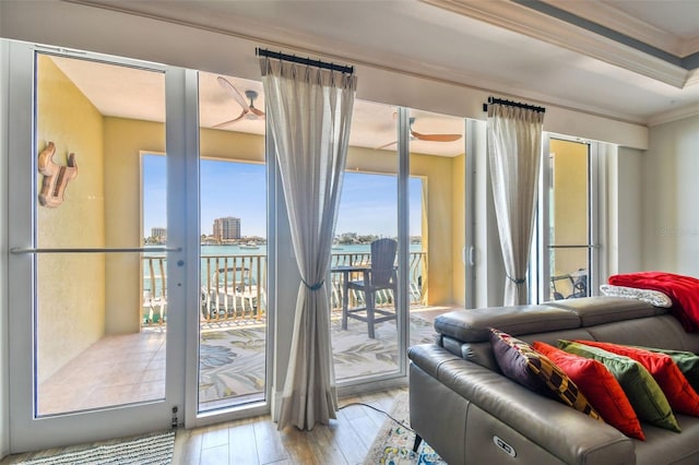 200 Skiff Pt Unit 202, Clearwater Beach, FL 33767 - living room featuring crown molding and wood-type flooring