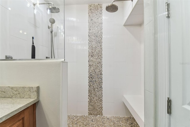 200 Skiff Pt Unit 202, Clearwater Beach, FL 33767 - bathroom featuring a walk in shower and vanity