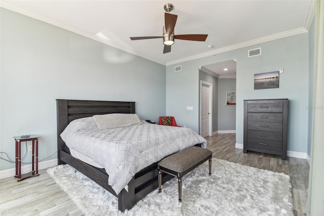 200 Skiff Pt Unit 202, Clearwater Beach, FL 33767 - bedroom featuring wood finished floors, baseboards, ornamental molding, and ceiling fan