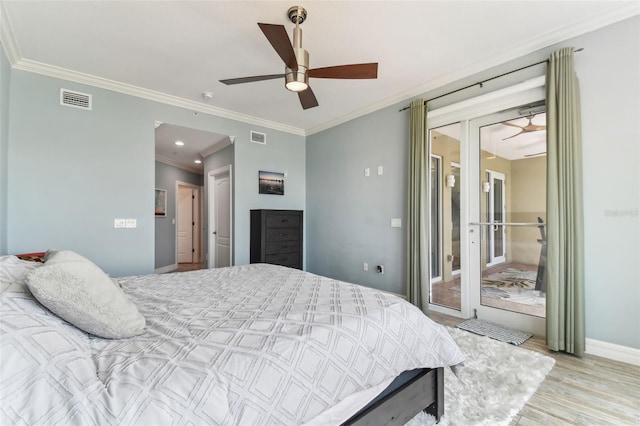 200 Skiff Pt Unit 202, Clearwater Beach, FL 33767 - bedroom featuring crown molding, wood finished floors, baseboards, access to outside, and ceiling fan