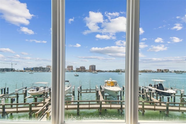 200 Skiff Pt Unit 202, Clearwater Beach, FL 33767 - water view with boat lift, nearby urban area, and a dock