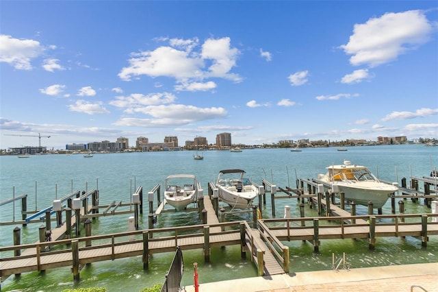200 Skiff Pt Unit 202, Clearwater Beach, FL 33767 - dock with boat lift, a water view, and a view of city