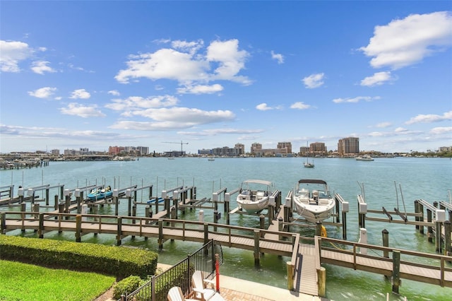 200 Skiff Pt Unit 202, Clearwater Beach, FL 33767 - dock with boat lift, a water view, and a skyline view