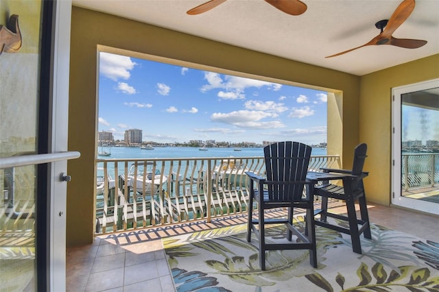 200 Skiff Pt Unit 202, Clearwater Beach, FL 33767 - balcony featuring ceiling fan and a water view