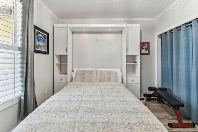 200 Skiff Pt Unit 202, Clearwater Beach, FL 33767 - bedroom featuring wood finished floors and ornamental molding