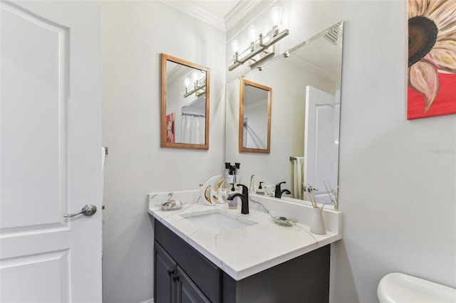 200 Skiff Pt Unit 202, Clearwater Beach, FL 33767 - bathroom with crown molding, vanity, and toilet