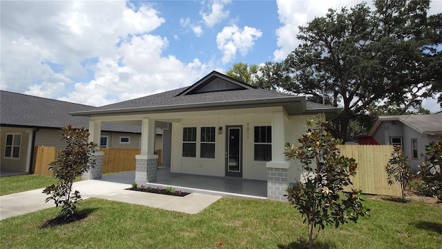 7011 N 15th St, Tampa, FL 33610 - view of front facade with a shingled roof and a porch