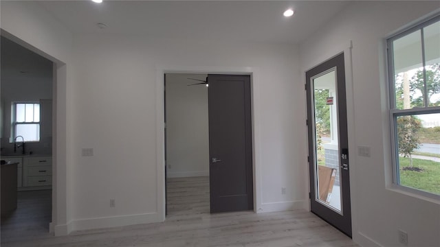 7011 N 15th St, Tampa, FL 33610 - foyer featuring light wood finished floors, recessed lighting, and baseboards