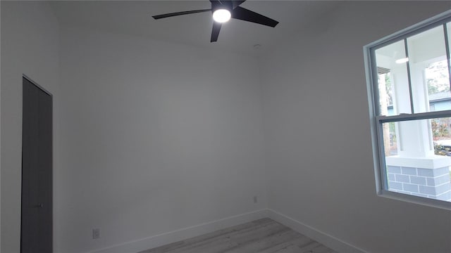 7011 N 15th St, Tampa, FL 33610 - empty room featuring light wood-type flooring, baseboards, and a ceiling fan