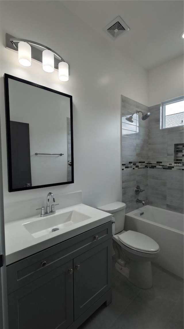 7011 N 15th St, Tampa, FL 33610 - full bath with vanity, toilet, tub / shower combination, and tile patterned flooring