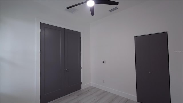 7011 N 15th St, Tampa, FL 33610 - unfurnished bedroom featuring light wood-type flooring, baseboards, ceiling fan, and a closet