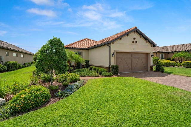 11354 Callisia Dr, Odessa, FL 33556 - mediterranean / spanish-style home with a tile roof, a front lawn, a garage, and stucco siding