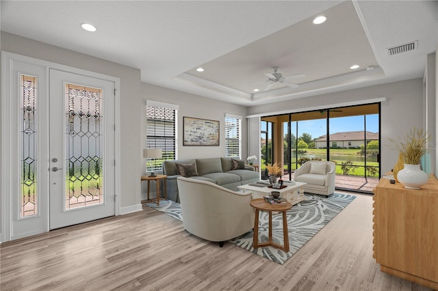 11354 Callisia Dr, Odessa, FL 33556 - living room with a raised ceiling, light wood-type flooring, recessed lighting, a ceiling fan, and baseboards
