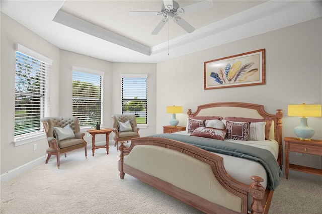 11354 Callisia Dr, Odessa, FL 33556 - bedroom featuring a tray ceiling, light carpet, baseboards, ceiling fan, and crown molding