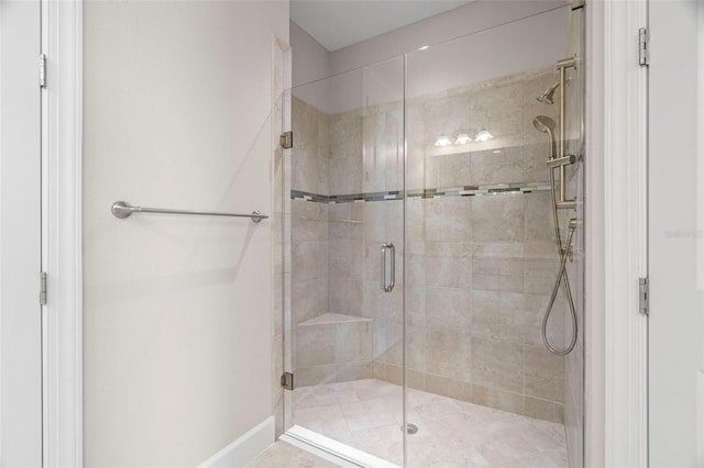 11354 Callisia Dr, Odessa, FL 33556 - bathroom featuring a shower stall and baseboards