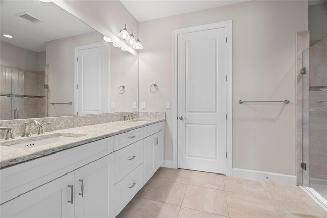 11354 Callisia Dr, Odessa, FL 33556 - bathroom featuring double vanity, a stall shower, baseboards, and tile patterned floors