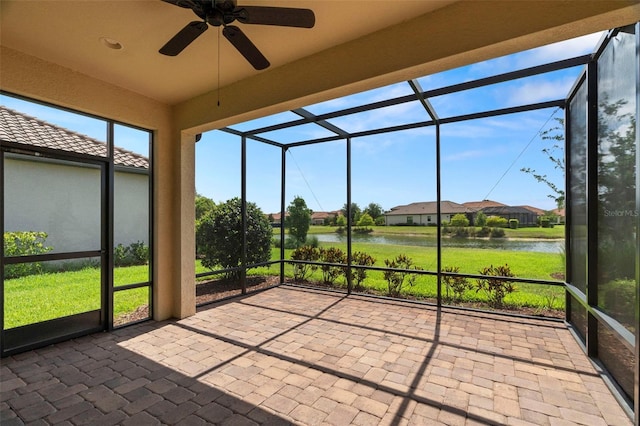 11354 Callisia Dr, Odessa, FL 33556 - unfurnished sunroom with a water view, a ceiling fan, and a residential view