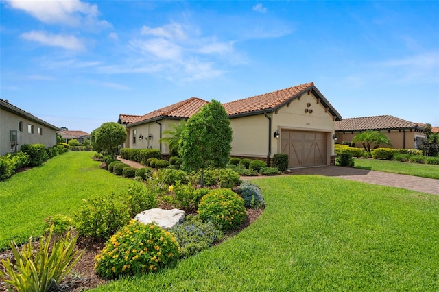11354 Callisia Dr, Odessa, FL 33556 - mediterranean / spanish-style home with a tiled roof, a front lawn, an attached garage, and driveway