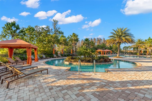 11354 Callisia Dr, Odessa, FL 33556 - community pool featuring a gazebo and a patio area