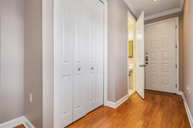 102 S Moody Ave Unit 1, Tampa, FL 33609 - entryway featuring ornamental molding, light wood-style floors, and baseboards