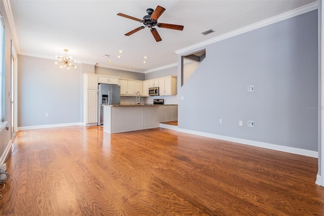 102 S Moody Ave Unit 1, Tampa, FL 33609 - unfurnished living room with ornamental molding, a chandelier, light wood-style flooring, ceiling fan, and a sink