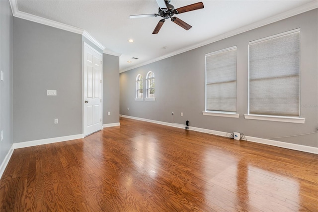 102 S Moody Ave Unit 1, Tampa, FL 33609 - spare room featuring ornamental molding, a ceiling fan, wood finished floors, baseboards, and recessed lighting