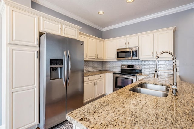 102 S Moody Ave Unit 1, Tampa, FL 33609 - kitchen with stainless steel appliances, a sink, light stone countertops, decorative backsplash, and ornamental molding