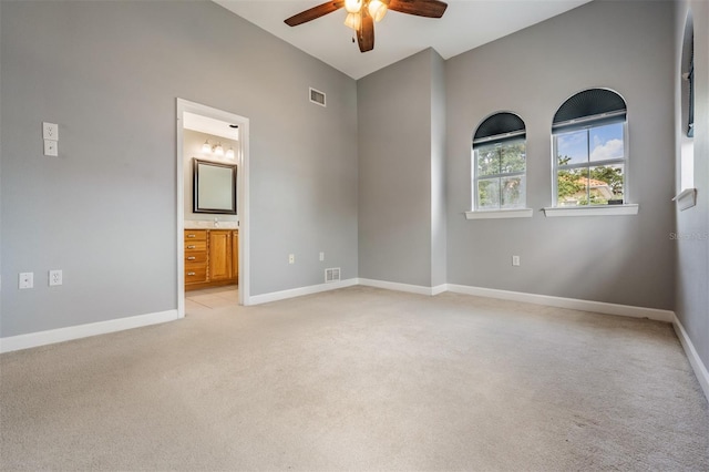 102 S Moody Ave Unit 1, Tampa, FL 33609 - empty room featuring ceiling fan, light carpet, and baseboards