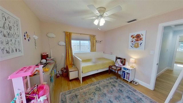 1200 47th St N, Saint Petersburg, FL 33713 - bedroom with wood finished floors, a ceiling fan, and baseboards