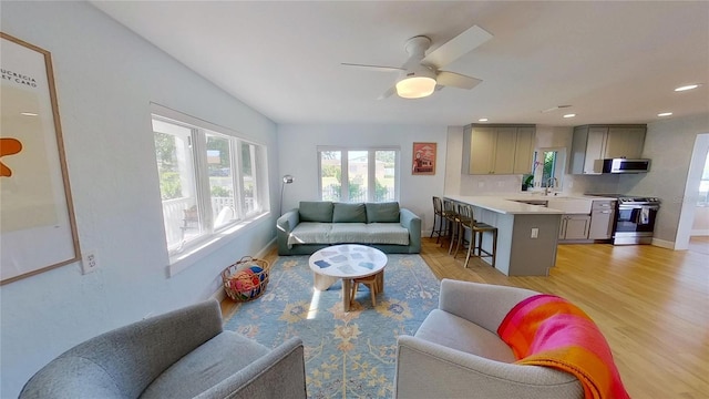 1200 47th St N, Saint Petersburg, FL 33713 - living room with light wood finished floors, a ceiling fan, baseboards, and recessed lighting