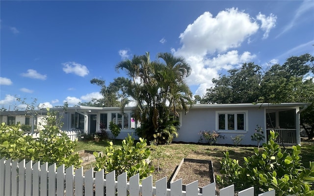 1200 47th St N, Saint Petersburg, FL 33713 - view of front facade featuring a vegetable garden and stucco siding