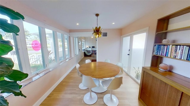 1200 47th St N, Saint Petersburg, FL 33713 - dining room with baseboards, healthy amount of natural light, light wood-type flooring, and recessed lighting