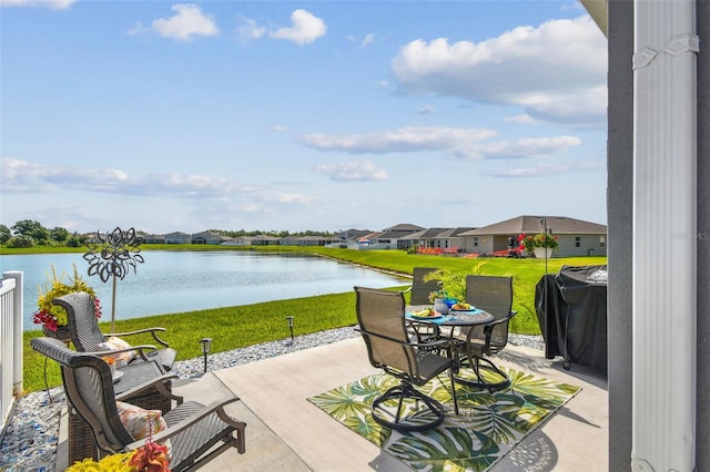 9577 Sandy Bluffs Cir, Parrish, FL 34219 - view of patio featuring a water view, grilling area, and a residential view